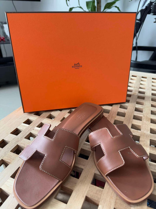 Hermès Oran Sandals Gold
