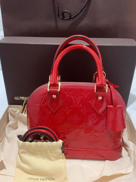 Louis Vuitton Alma BB leather handbag